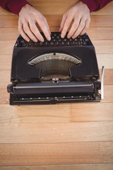 High angle view of man using typewriter