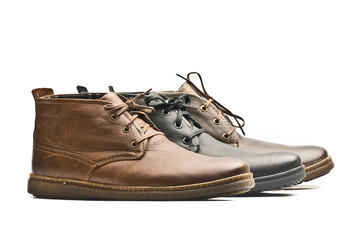 Mens brown and black shoes on white background