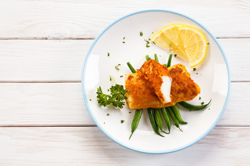 Fish dish - fried fish fillets and vegetables 