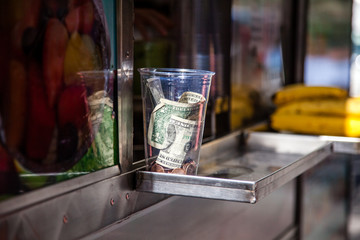 Tip jar at food cart in New York City