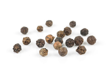 black pepper corns on white background