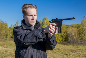 A man shoots a gun Mauser