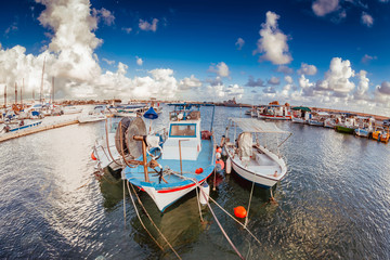 Old moored fishing boats in a Paphos harbour, Cyprus