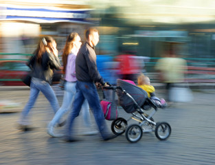 Young family with small child and a stroller