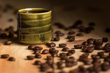 Espresso in coffee cup with coffee beans