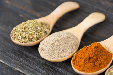 Spices and herbs in  bowls.