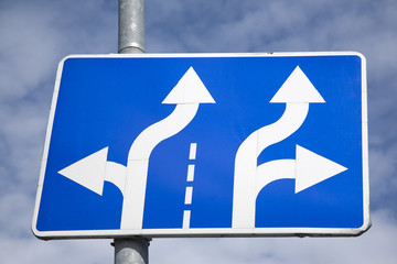 Blue and White Double Arrow Sign