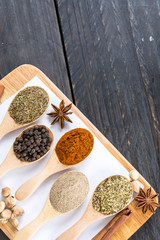 Spices and herbs in  bowls.