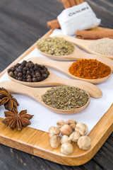 Spices and herbs in  bowls.