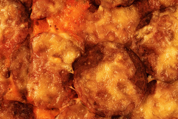 Pizza with salami as background
