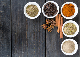 Spices and herbs in  bowls.