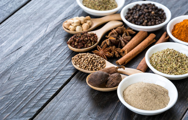 Spices and herbs in  bowls.