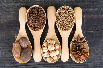 Spices and herbs in  bowls.