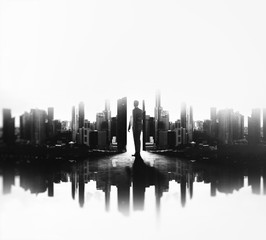 BW double exposure of young business man in city