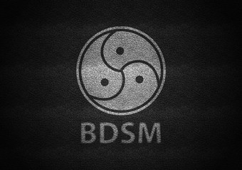 Bdsm sign white embossed on black leather