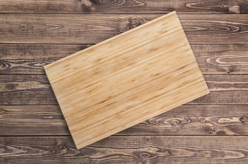 Naklejka na ściany i meble cutting board on wooden table. top view