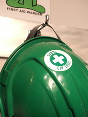 Green helmet of a first aid practitioner on a wall storage, Melbourne 2015