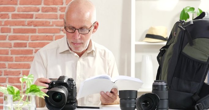 a man reads the manual of your camera