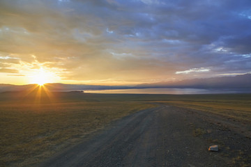 Fototapeta na wymiar Sunset over mountain lake Uureg nuur