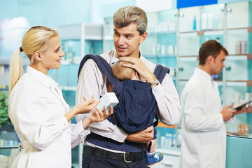 Obraz na płótnie Canvas Pharmacy chemist, father and child in drugstore