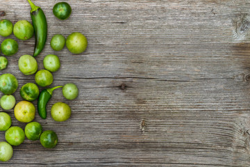 tomatos and peppers, vegetables, still life in wooden background