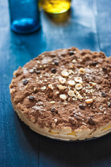 Coffee mousse with hazelnuts on the black wooden table