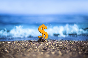 American Dollar currency icon is standing on the wavy sea side