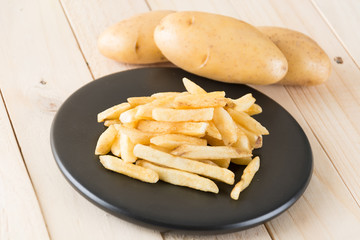 french fries on wood background