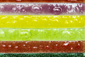 Narrow rectangular strips of artistic glass multicolored.