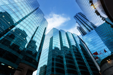 landmarks reflection on glass walls of skyscrapers