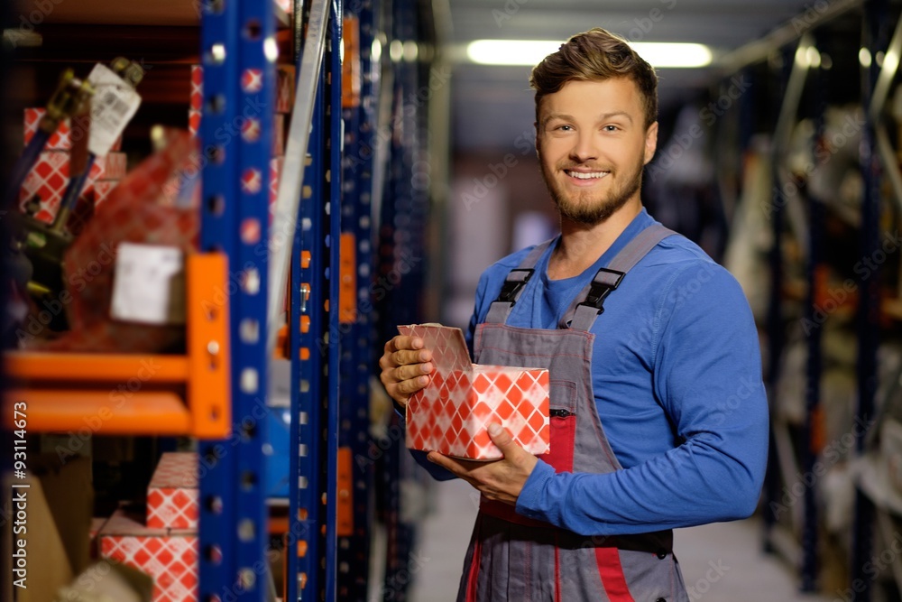 Canvas Prints worker on a automotive spare parts warehouse