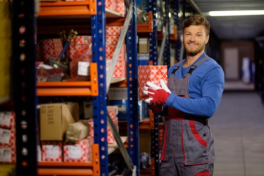 Worker On A Automotive Spare Parts Warehouse