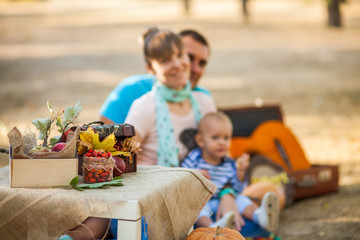 Happy family at autumn picnic