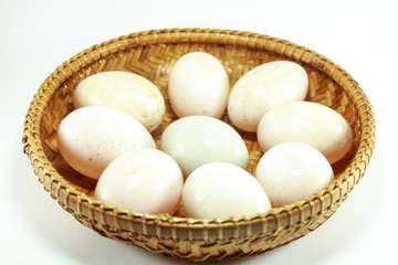  duck eggs in the bamboo bowl basket on white background