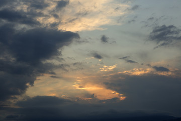 Naklejka na ściany i meble Sky is overcast with clouds at sunset.