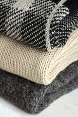 beautiful stack of warm sweaters closeup