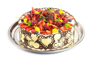 Celebration cake decorated with fruits and chocolate