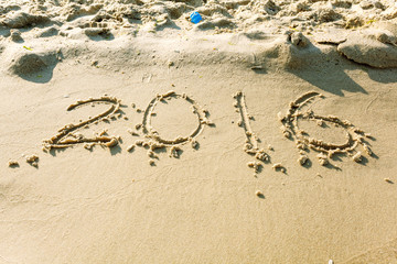 Year 2016 on the beach for background