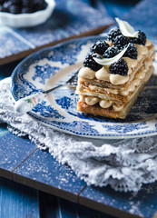 Millefeuille, french pastry with custard and blackberry 
