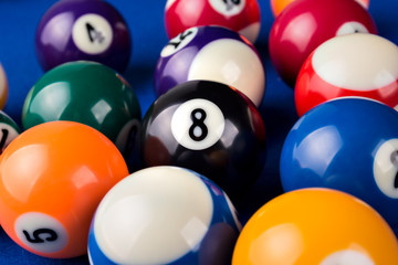 Billiard balls in a blue pool table.