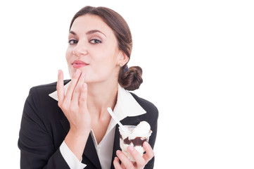 Naklejka premium Young business woman wipping her chin after eating ice cream
