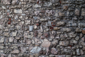 pattern gray color of modern style design decorative uneven cracked real stone wall surface with cement