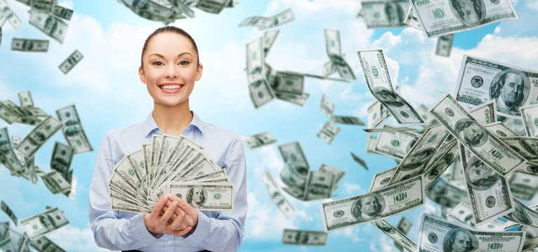 smiling businesswoman with dollar cash money