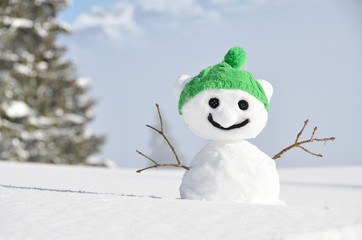 Snowman against Alpine scenery