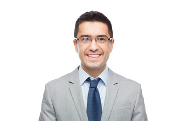 happy smiling businessman in eyeglasses and suit