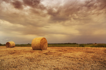 Straw bales with dramatic sky