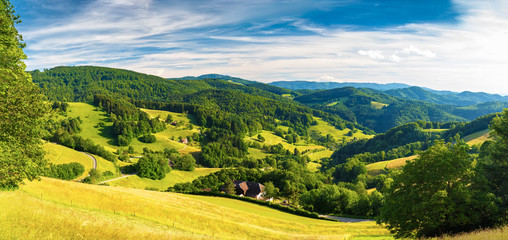 Scenic panoramic landscape: summer mountain valley with forests and fields in Germany, St. Ulrich, Black Forest - obrazy, fototapety, plakaty