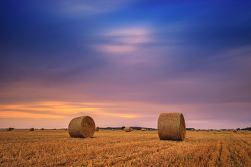 Straw bales with dramatic sky