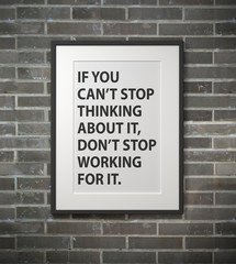 Inspirational motivating quote on picture frame.