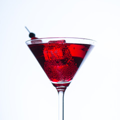 Fire blowing out of martini glass/close-up with white background